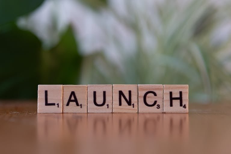 Scrabble tiles spelling 'launch' reflecting entrepreneurship and innovation.