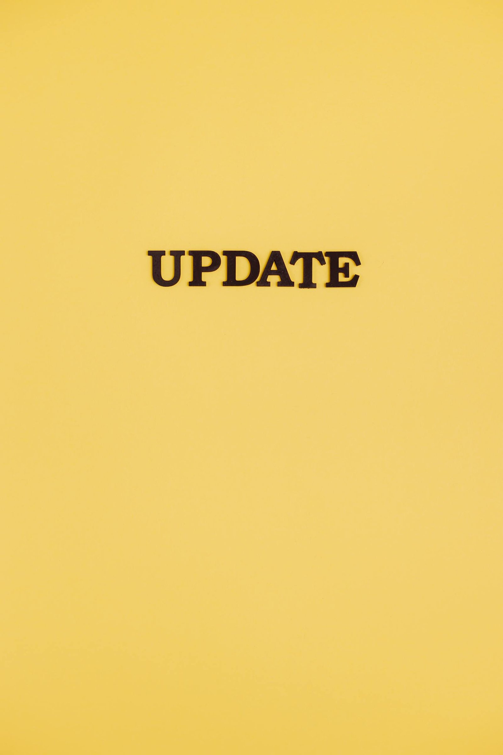 A bold black 'UPDATE' text on a yellow background, ideal for business or tech themes.